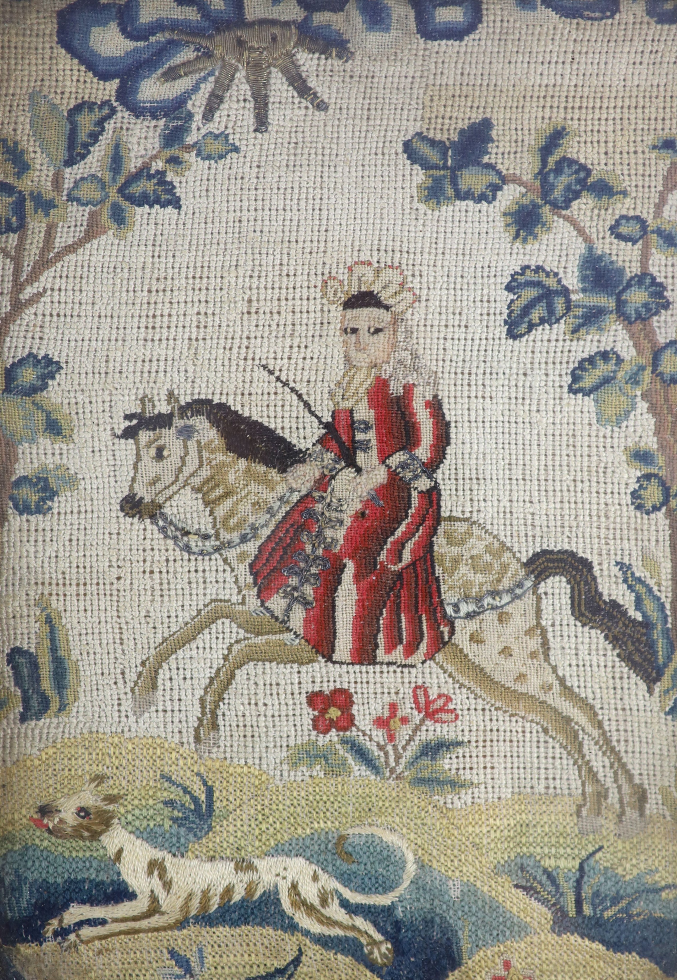 A pair of framed early 18th century needlework panels of a lady and gentleman on horseback with dogs running at their feet 23x16cm excl frame